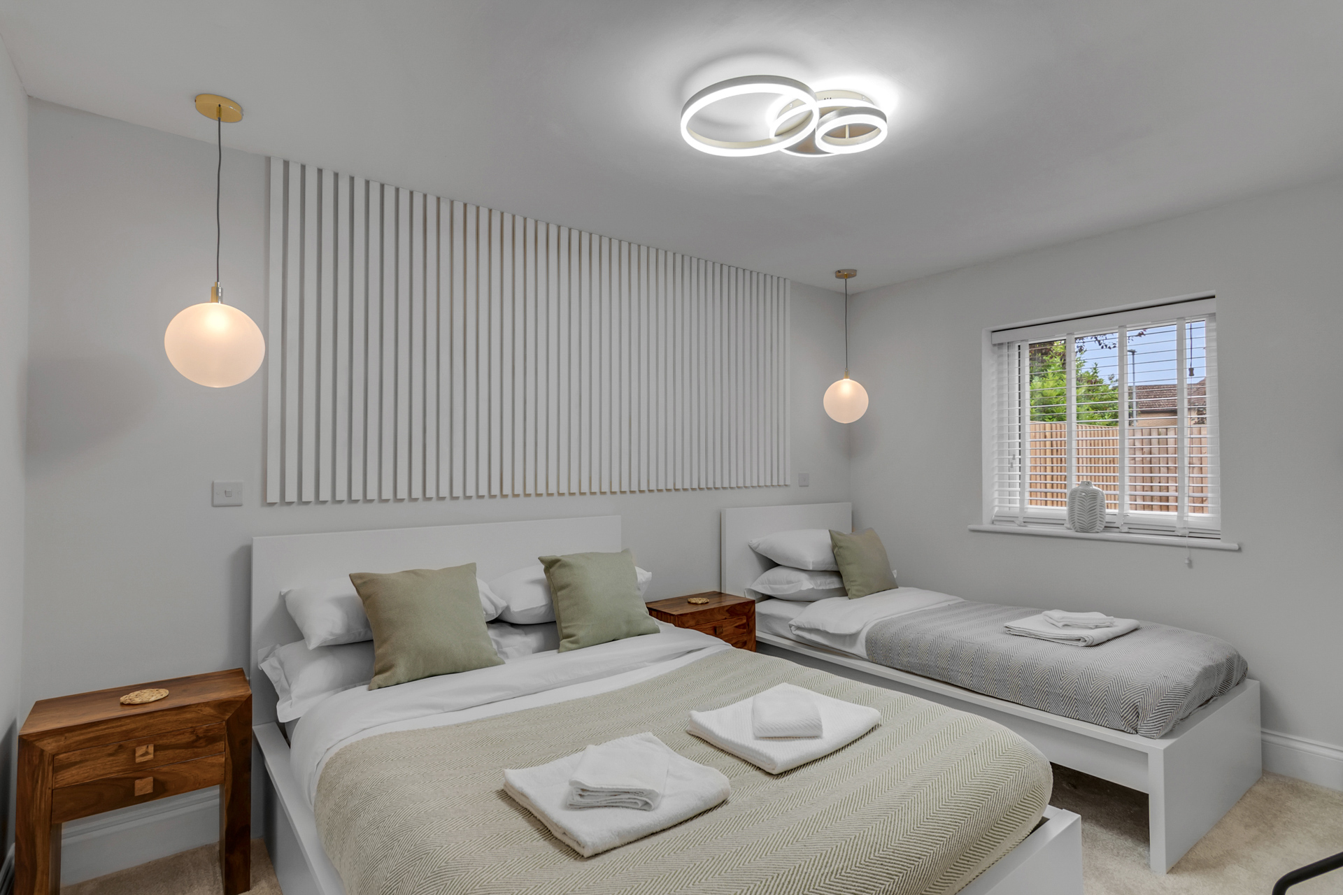 Staged HMO twin bedroom with high-quality furnishings